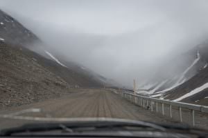 Driving into the storm at the top of Atigun Pass
