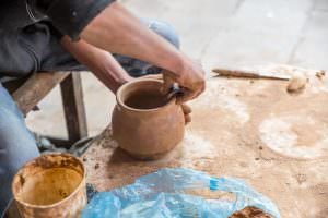 Creating a clay pot.